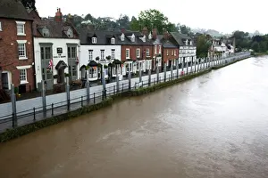 Floods: UK - Flood barriers protecting riverside houses