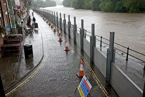 Floods: UK - Flood barriers protecting riverside houses