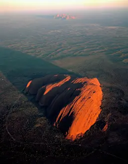 Ayers: Uluru (Ayers Rock) at sunrise, aerial