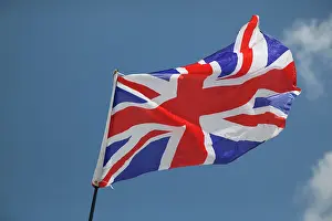 Flags: Union Jack flag - flying in light breeze against blue sky