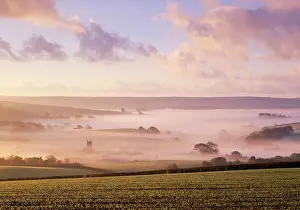 Anthony Harrison: United Kingdom - misty valley with church & clouds