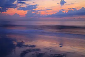 Surf: USA, Georgia, Tybee Island. Sunrise with clouds