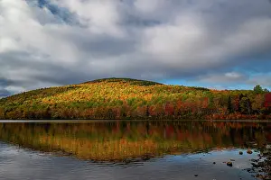 Maine: USA, Maine. Fall foliage and mountain reflection on pond