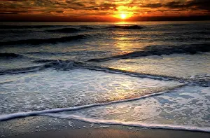 Foam: USA, New Jersey, Cape May. Sunset reflection