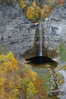 Howie Garber: USA, New York. Creek, fall foliage and Taughannock Falls at