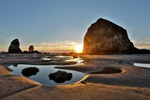 Stack: USA, Oregon. Cannon Beach with Haystack near sunset