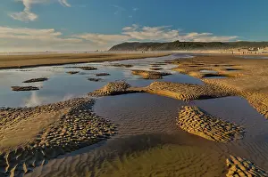 Tide: USA, Oregon. Cannon Beach low tide and ripples in the sand