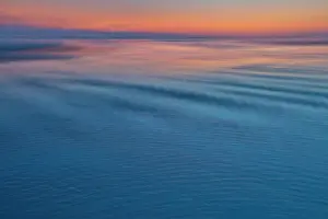 Ripple: USA, Oregon, Cannon Beach. Sunset blues with ripples