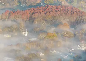 Church: USA, Tennessee. Church steeple rises above fog