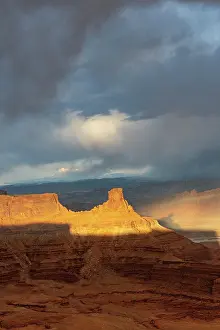 Point: USA, Utah. Sunset light breaking through desert