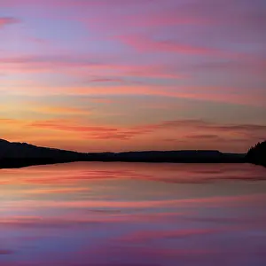 Canal: USA, Washington State, Seabeck. Composite sunset