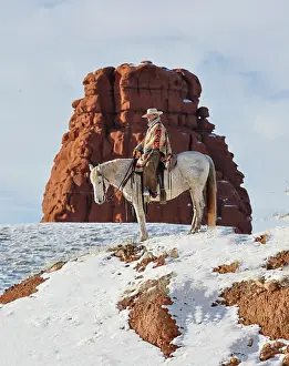 Model: USA, Wyoming. Hideout Ranch cowgirl on horseback