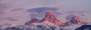 Idaho: USA, Wyoming. Panoramic landscape of alpenglow over Teton
