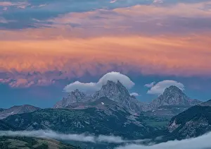 Wyoming: USA, Wyoming. Sunset and stratus clouds over Teton Range