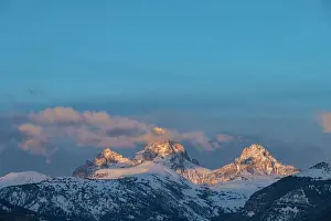 Grand: USA, Wyoming. Sunset over Teton Mountains from the