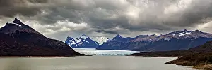 Glaciers: Vast, dramatic landscape in a panoramic format with glaciers and clouds over the horizon