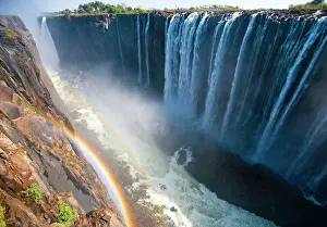 Smoke: Victoria Falls. A general view with a rainbow. N