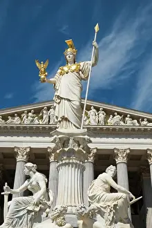 Statue: Vienna, Austria. Beautiful Parliament building in Vienna