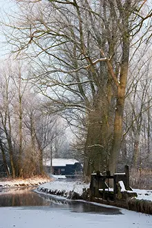 Lock: View on the 14th century coll watermill in winter landscape