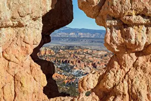Opening: View of Bryce Canyon through an arched rock, Utah