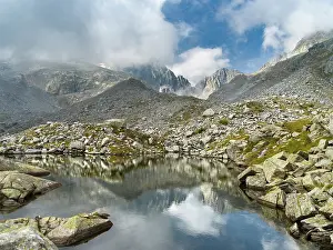 Parco: View towards Cima Presanella draped in clouds near