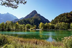 Opposite: A view of Lake Jasna with forest and mountain landscape