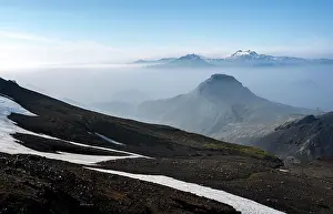 Thorsmork: View of mountain peaks between fog, peak Utigonguhofdi