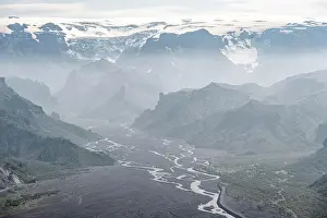 Thorsmork: View into mountain valley with glacier river Krossa