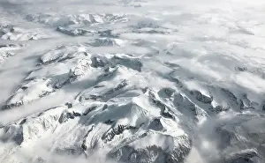 Plane: View from the plane to snow-covered mountainous