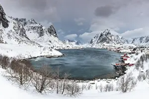 Lofoten: View of Reine with Reinefjord, snow-covered mountains
