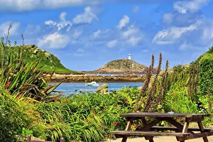 Lighthouse: View from restaurant terrace of coastline with lighthouse