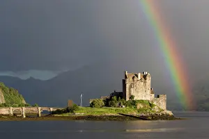 Prismatic: View of restored castle on tidal island in sea loch