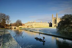 University: View of river with punt approaching bridge and college