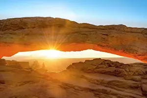 Canyonlands: View through rock arch, Mesa Arch, sunbeams, sunrise