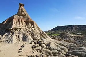 Sandstone: View of a rock formation in a dry, barren desert landscape