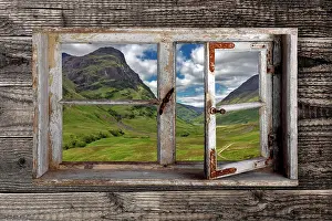 Argyll: View through a rustic wooden window into the Glen
