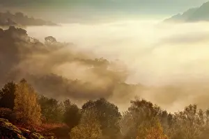 Atmosheric: View of Rydal Water covered in mist from White
