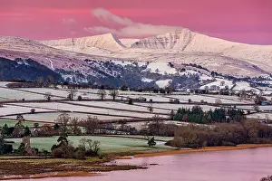 Beacons: View of snow covered farmland and hills at sunrise
