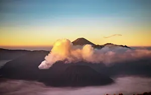 Smoking: View of volcanoes at sunrise, smoking volcano Gunung