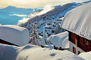 Townsmall: Village view with snow-covered houses, in the back