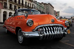 1950s: Vintage Buick from the 1950s on the Prado at dusk