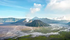 Smoking: Volcanic landscape at sunrise, smoking volcano Gunung