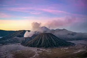 Smoking: Volcanic landscape at sunrise, smoking volcano Gunung
