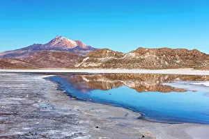 Salar: Volcano Cerro Tunupa with reflection in the Salar
