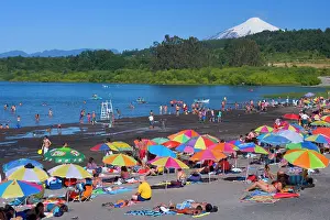 Heavily: Volcano Villarrica and beach - snow covered volcano
