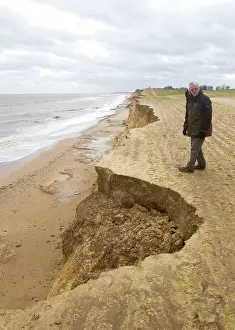 Walkers: Walker along the edge of Cliff erosion