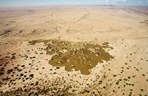 Recent: Water from recent rains accumulates in an excavation