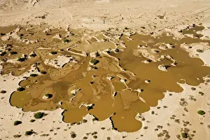 Recent: Water from recent rains accumulates in an excavation