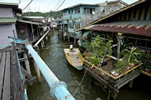 Plank: Water Village Walkway with blue water pipe and shacks