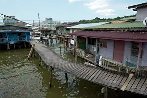 Plank: Water Village Walkway and shacks on stilts in Brunei River